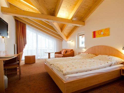 Кровать или кровати в номере Hotel Monte-Moro