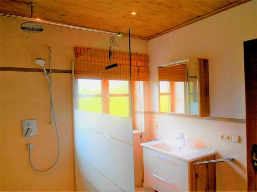 a bathroom with a shower and a sink at Matheishof in Ruhpolding