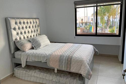 Ліжко або ліжка в номері Preciosa Enjoyable Casa 12 Personas Alberca Playa Coto 24H
