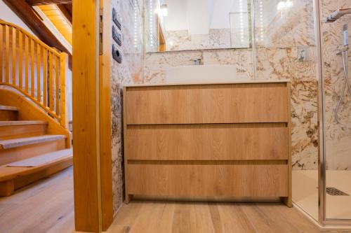 a bathroom with a sink and a shower at Residenza Marconi in Pinzolo
