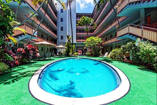 a large swimming pool in the middle of a building at Hawaiian King in Honolulu