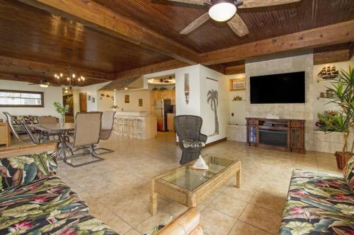 a living room with a couch and a table at Hawaiian King in Honolulu