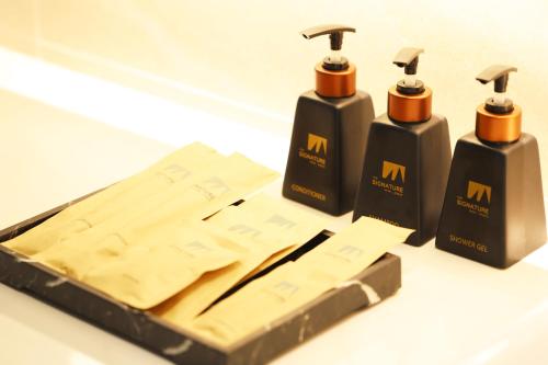 a box of two hair products on a table at The Signature Hotel Airport in Hat Yai