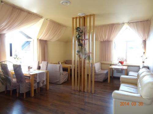 a living room with a couch and a table at Bogema Motel in Solonka