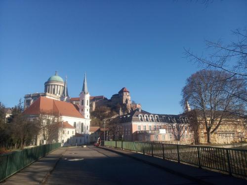 a bridge over a street with buildings in the background at Esztergom Central in Esztergom