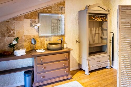 a kitchen with a sink and a cabinet at Abacard Home Chambre d'Hôtes adult only in Roquemaure