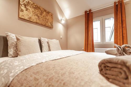 a bedroom with a bed and a window at Luxury Suites Palace by Rikas Hotels in Antwerp