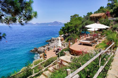 a view of a body of water with a beach at Perdue Hotel in Faralya