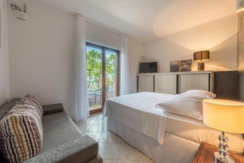 Posteľ alebo postele v izbe v ubytovaní Apartments Ivana-Mira