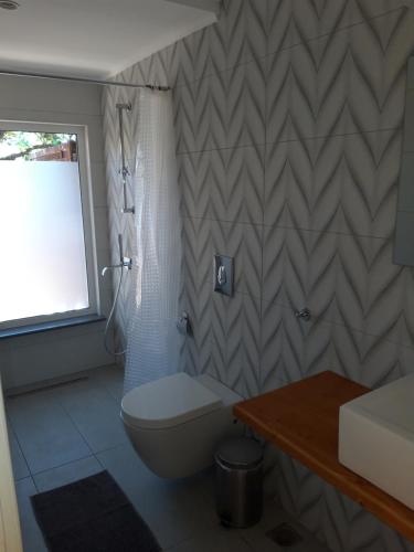 A bathroom at Athina Apartments