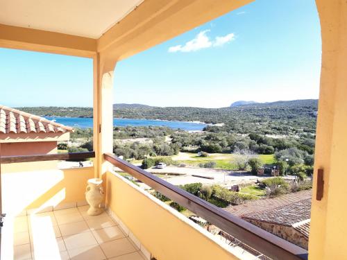 a balcony with a view of the water at Sardegna Top Golfo Di Marinella in Golfo Aranci