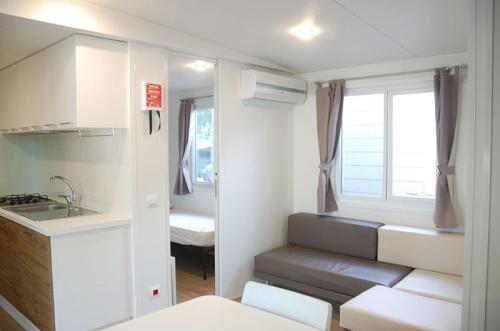 Кровать или кровати в номере Villaggio Camping Adria