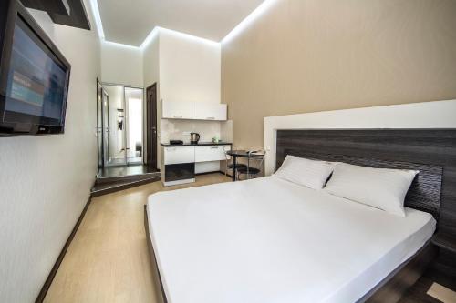 Кровать или кровати в номере Central Apartments Maidan Area