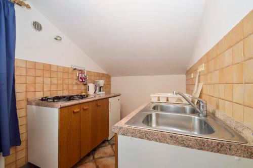 Kuchyň nebo kuchyňský kout v ubytování Apartments Silvana 597