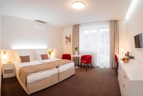 Postel nebo postele na pokoji v ubytování Hotel Vila Viola