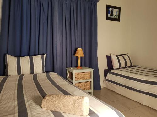 Ένα ή περισσότερα κρεβάτια σε δωμάτιο στο Point Village Accommodation - Ocean Two 12