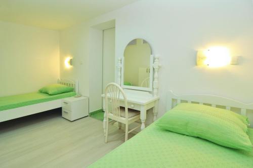 Postel nebo postele na pokoji v ubytování Apartments Tojčić