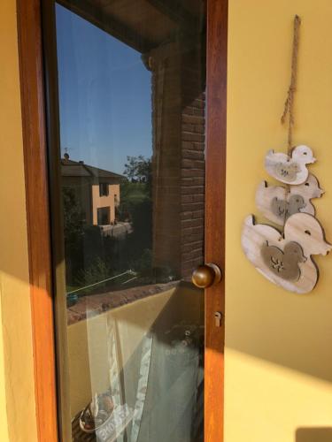 a door with a group of towels hanging on it at La Nana Gialla in Riotorto