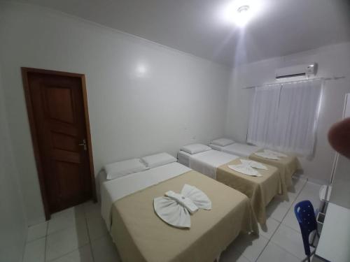 Ein Bett oder Betten in einem Zimmer der Unterkunft Hamara Soft Hotel 1