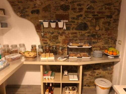 a room with a table with food on it at La Nana Gialla in Riotorto