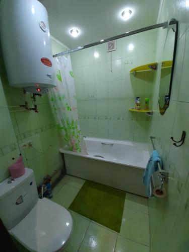 Ванная комната в Двухкомнатные аппартаменты в центре города