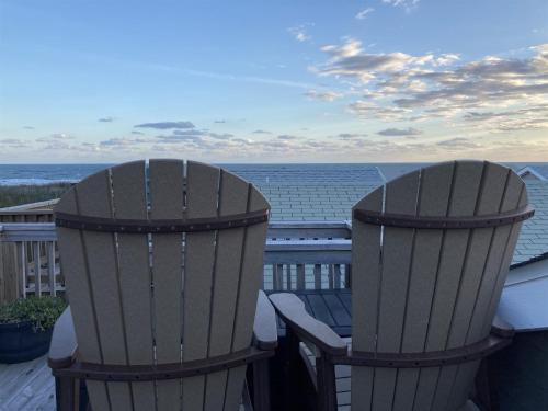 two chairs on a deck looking out at the ocean at 35 SEA SEITZ condo in Hatteras