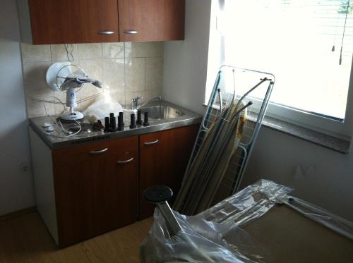 a kitchen with a sink and a counter top at Apartments Baba Luce in Strica