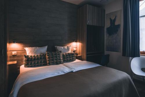 Säng eller sängar i ett rum på AUBERGE FRANKENBOURG