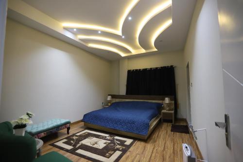Una cama o camas en una habitación de Aloche Apartments