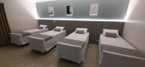 Ένα ή περισσότερα κρεβάτια σε δωμάτιο στο Liv Hotel