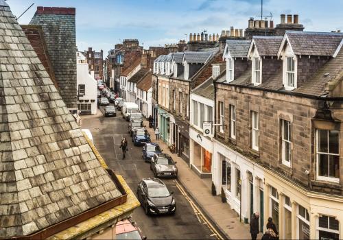 a view of a city street with cars parked at Scott's View in North Berwick