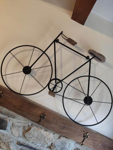 a metal object is hanging on a wall at Le Héron in Houffalize