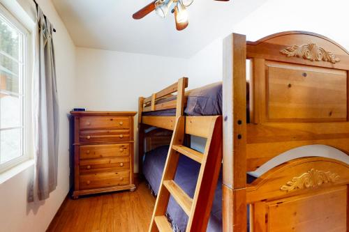 a bedroom with two bunk beds and a dresser at Breathtaking Hyak Home in Snoqualmie Pass