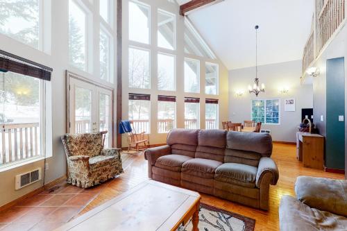 a living room with a couch and a table at Breathtaking Hyak Home in Snoqualmie Pass