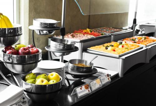 a buffet line with many different types of food at Holiday Inn Express Toluca Galerias Metepec by IHG in Toluca