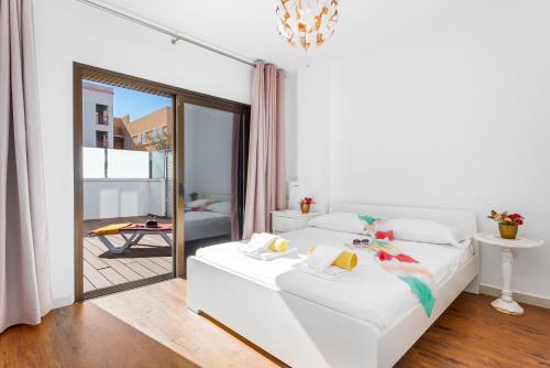 Giường trong phòng chung tại KALIMA LUXURY PROPERTY Big Terrace