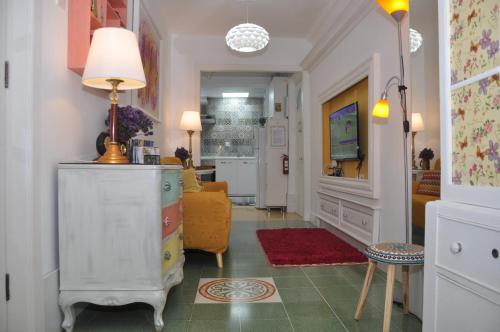 a living room with a lamp on a dresser at Private Apartment in Pembroke St Julians in Pembroke 