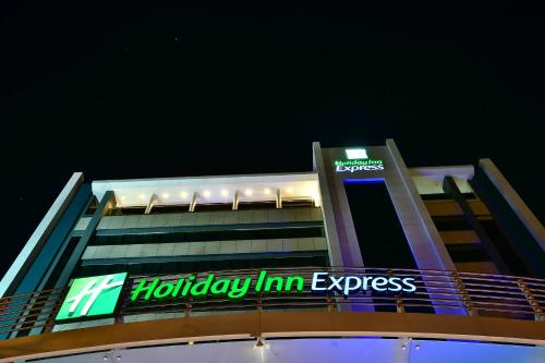 a building with a holiday inn express sign on it at Holiday Inn Express Asuncion Aviadores by IHG in Asuncion