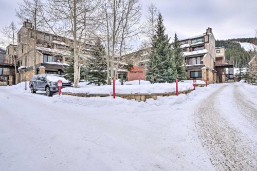 a snow covered street in front of a building at Ski-InandSki-Out Condo with Hot Tub on Copper Mountain in Frisco