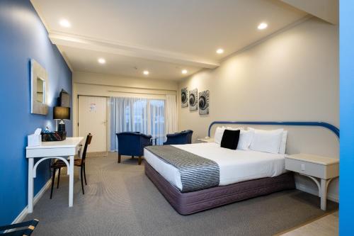 Postel nebo postele na pokoji v ubytování Motel de la Mer
