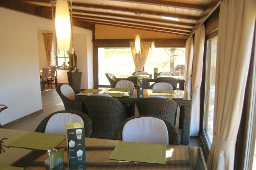 a dining room with tables and chairs and a table and chairsktop at Wellness Hotel Kempa in Jablunkov