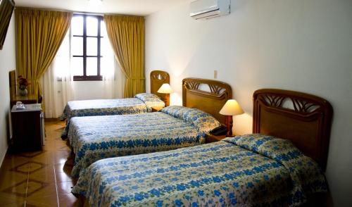 Voodi või voodid majutusasutuse Hotel Chucarima toas