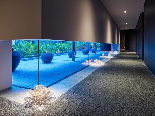 a blue and white swimming pool in a room at Mitsui Garden Hotel Nihonbashi Premier in Tokyo