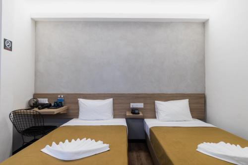 Кровать или кровати в номере Urban Inn, SP Saujana