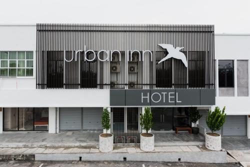 a hotel sign on the front of a building at Urban Inn, SP Saujana in Sungai Petani