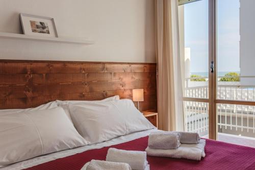 Letto o letti in una camera di Casa Portofino Rooms&Breakfast