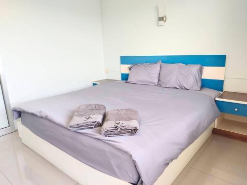 Cama o camas de una habitación en โรงแรมวิจิตรพร อุบล VJP Hotel Ubon