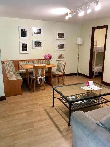 a living room with a table and chairs at Agroturismo Anziola in Oiartzun
