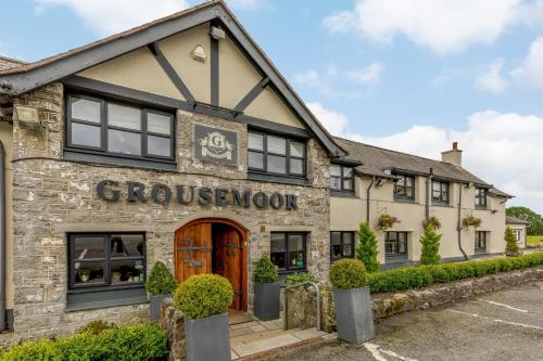 a building with a sign that reads groulezovan at The Grousemoor - North Wales luxury 7 bedroom holiday rental in Llandegla