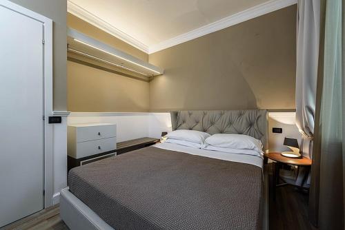 Ліжко або ліжка в номері Palazzo Bovio - Boutique Apartments